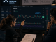 Traders analyzing XRP as it stays below $1.12